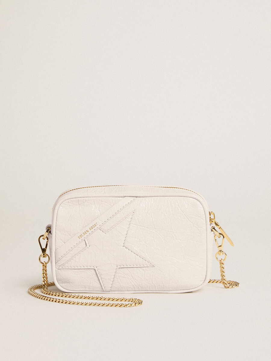 mini torebka star bag z białej skóry w kolorze maślanym z gwiazdą w tym samym kolorze