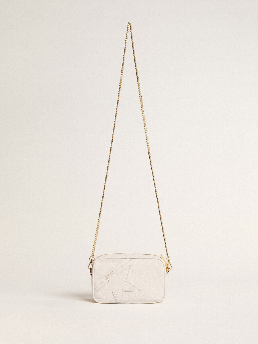 mini torebka star bag z białej skóry w kolorze maślanym z gwiazdą w tym samym kolorze