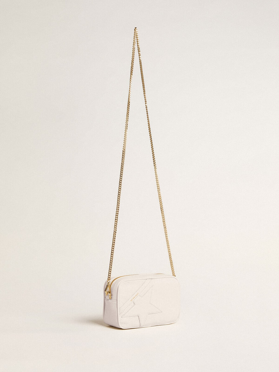 mini torebka star bag z białej skóry w kolorze maślanym z gwiazdą w tym samym kolorze