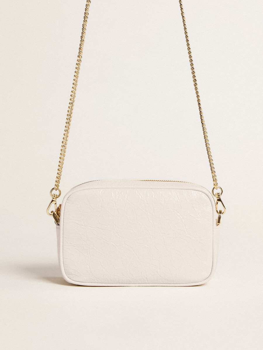 mini torebka star bag z białej skóry w kolorze maślanym z gwiazdą w tym samym kolorze