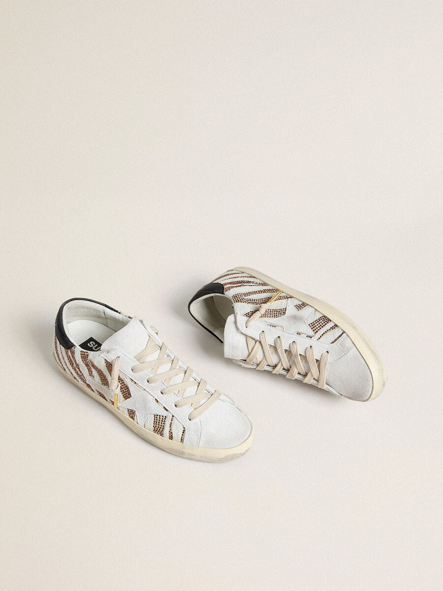 damskie buty super-star ltd w kolorze białym z motywem skóry kucyka z brązowym brokatem i białą zamszową gwiazdką